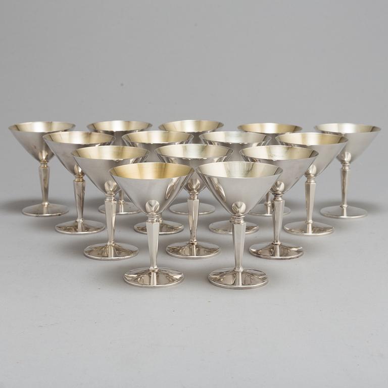 A SET OF 14 SILVER COCKTAILGLASSES, 1960s.