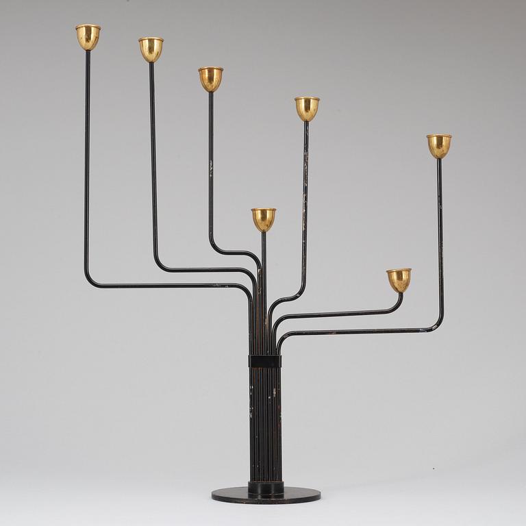 A Piet Hein brass and black lacquered metal candelabrum, 1950's-60's.