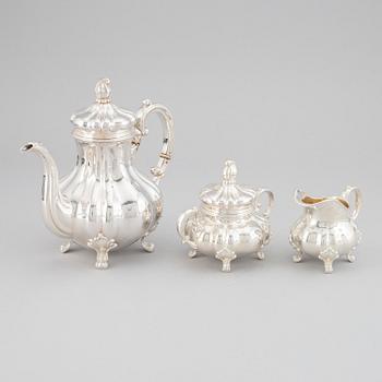 A 20th century silver coffee pot, creamer and sugar bowl. Swedish import mark.