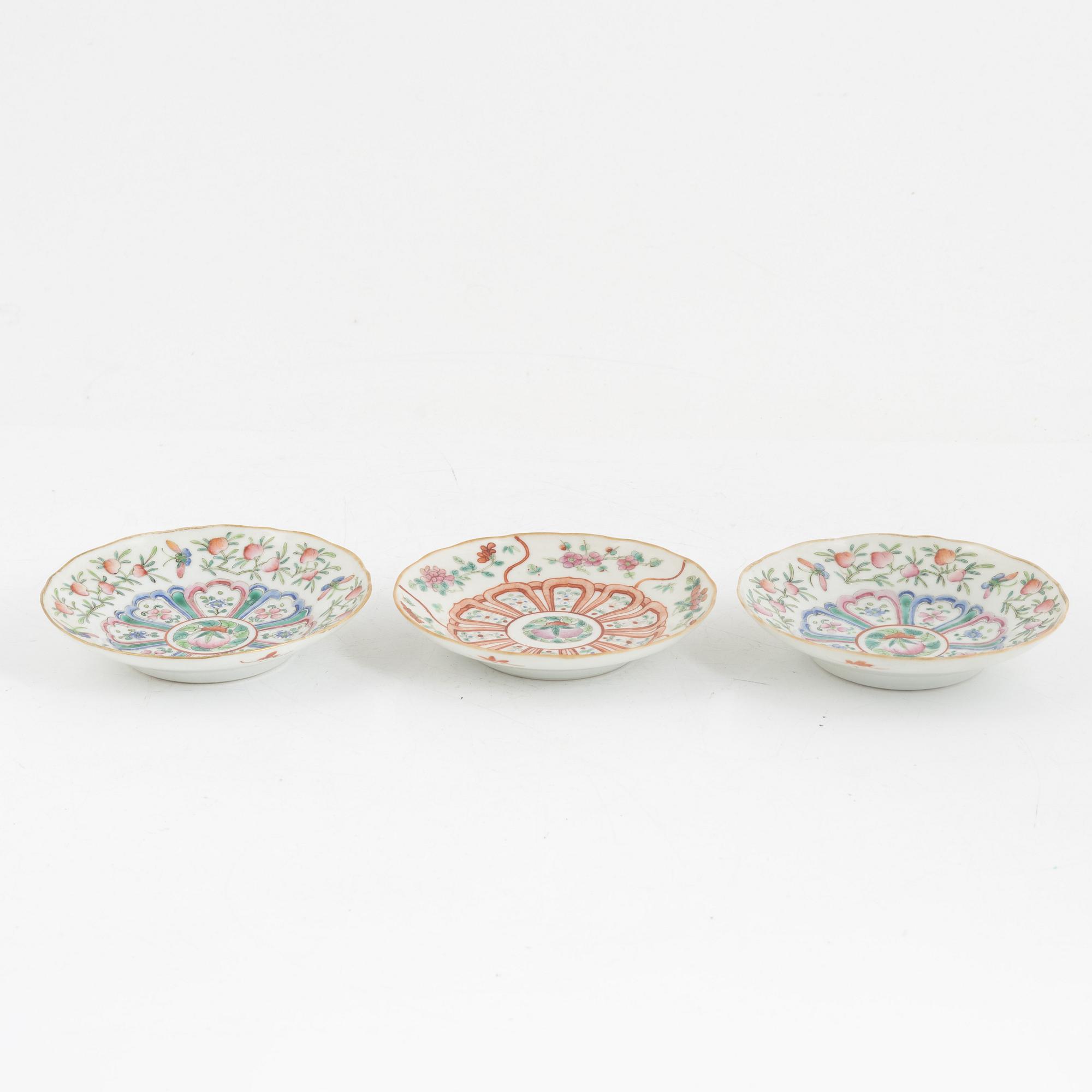 A pair of Chinese famille rose porcelain covers, and three saucers, late Qing dynasty, 19th century.
