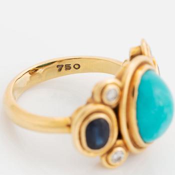 An 18K gold and turquoise Grima ring set with faceted sapphires and round brilliant-cut diamonds.