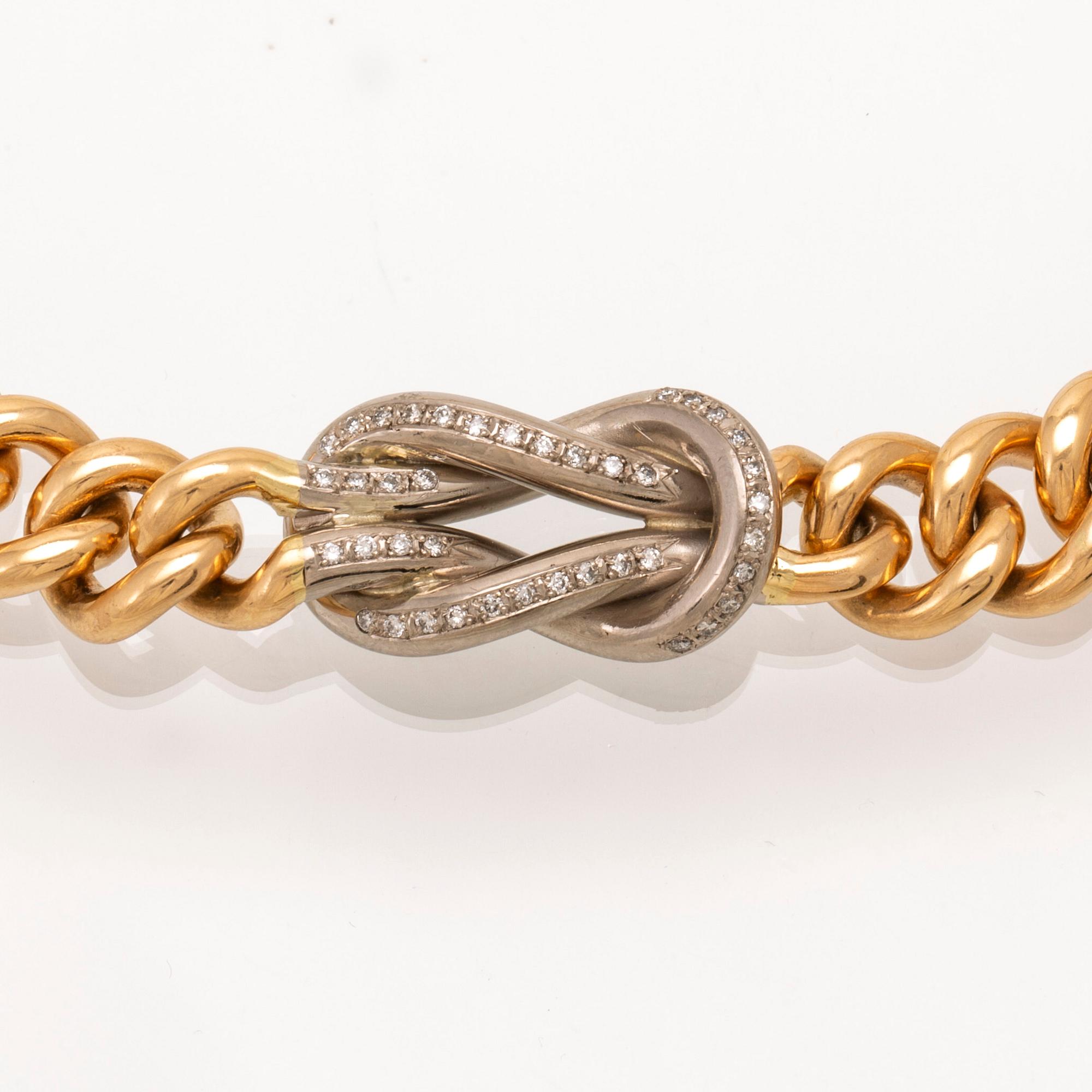 An 18K gold necklace weight 183,6 grams, 0,4 ct brilliants.