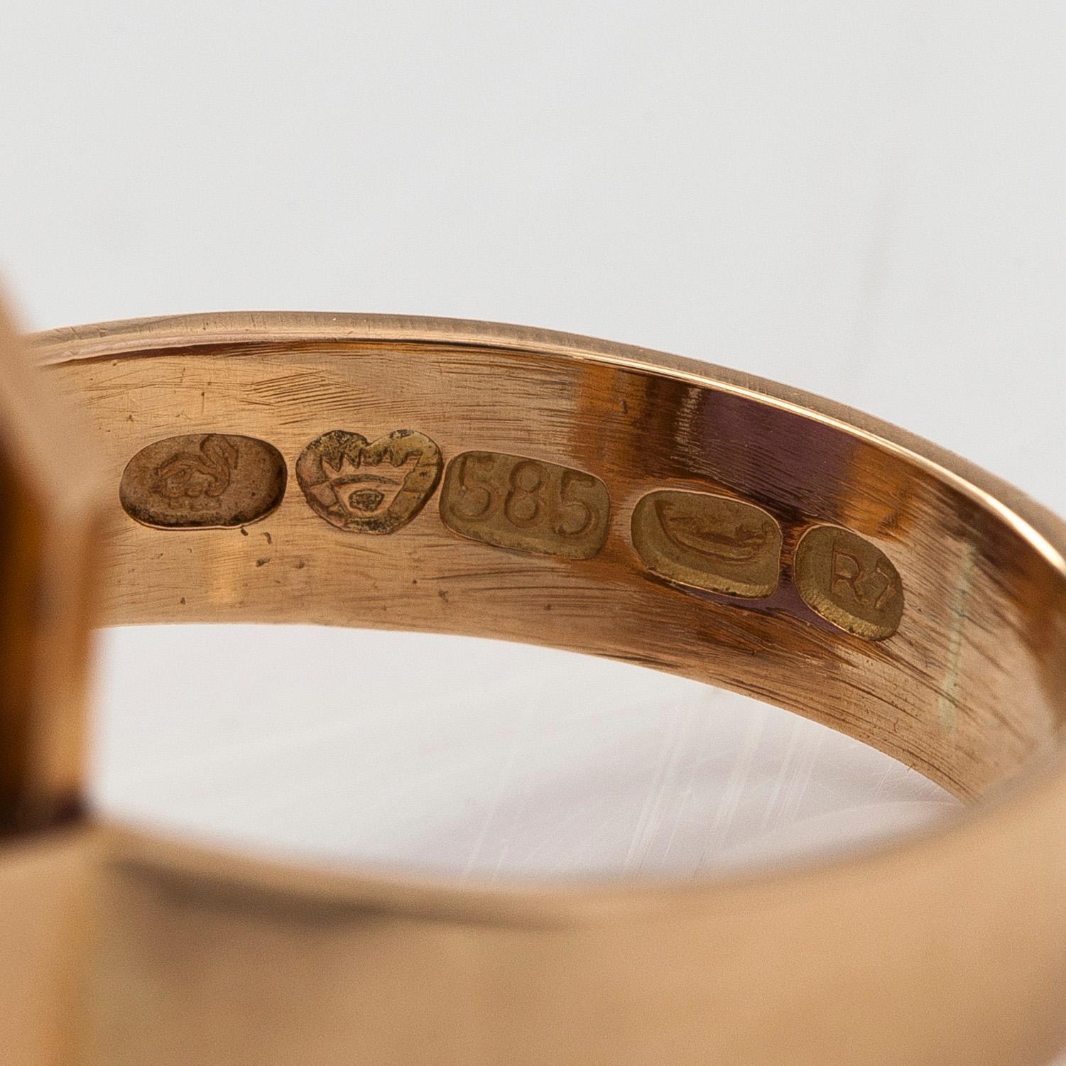 A 14K gold ring with amethyst.