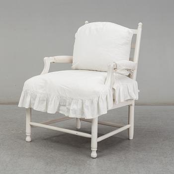 A Gustavian-style late 20th century armchair.