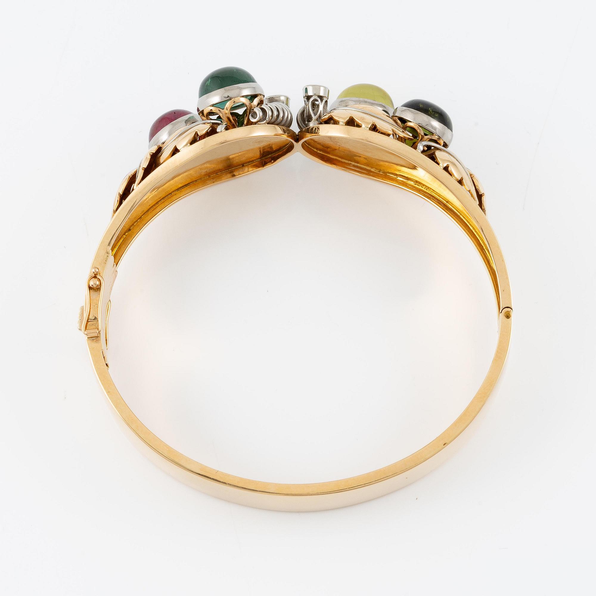 An 18K gold bracelet with cabochon-cut tourmalines.