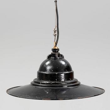 An early 20th century industrial lamp.