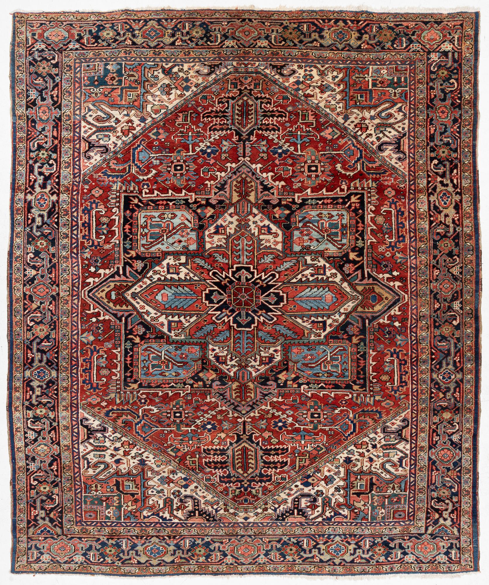 A semi-antique Heris carpet, c. 364 x 299 cm.