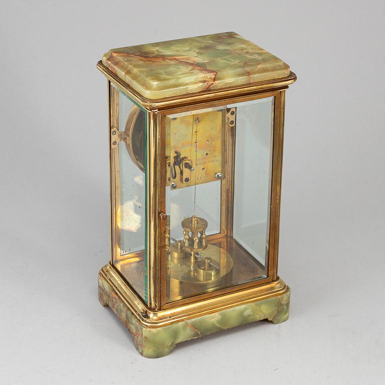 A French onyx and brass mantel clock, first half of the 20th century.