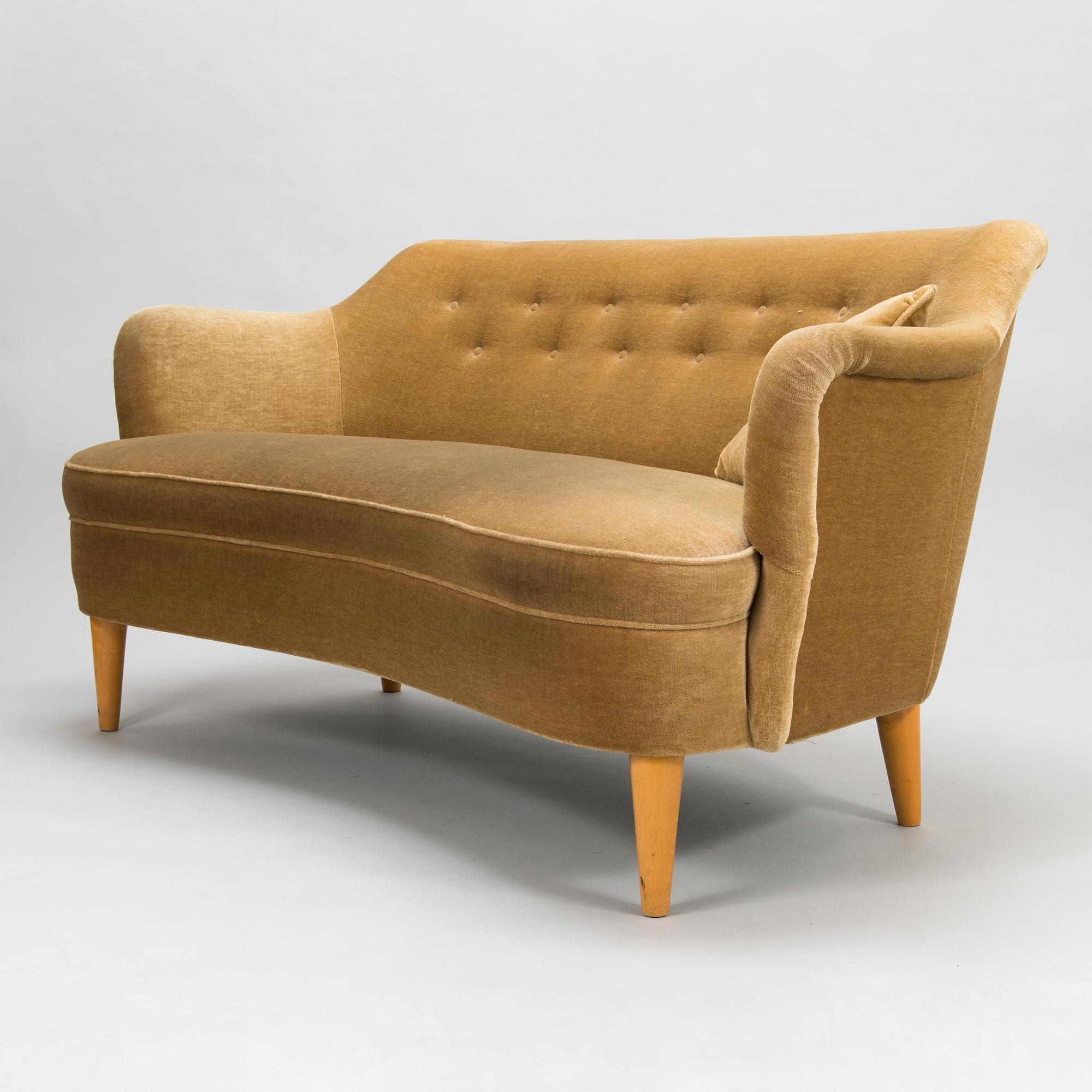 A mid-20th-century sofa and armchair.