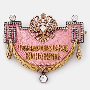 227. A FABERGÉ GOLD, ENAMEL AND DIAMOND NOBEL BROOCH.