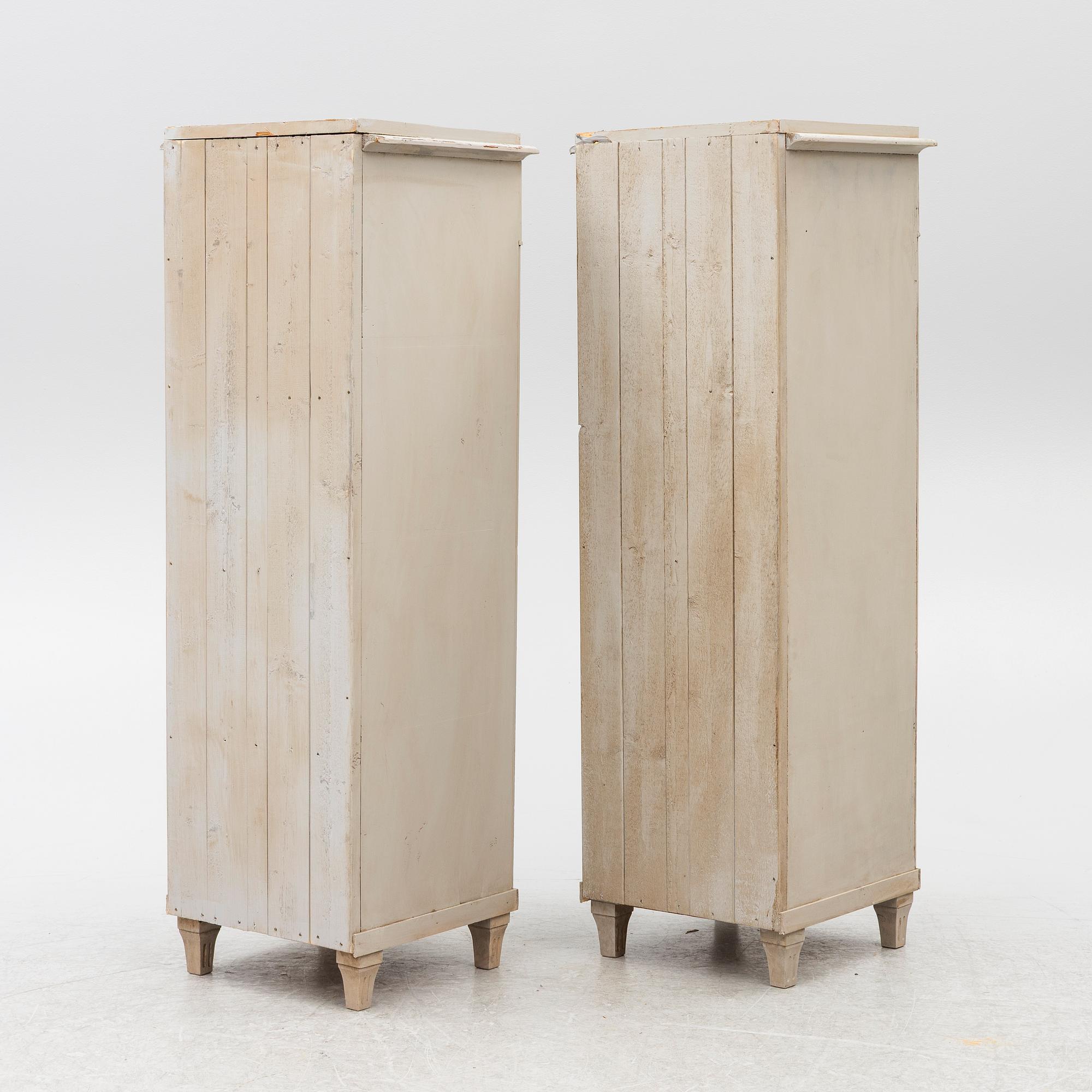 A pair of column cabinets, circa 1900.