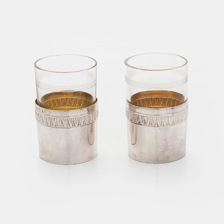 A set of six shot glasses with a tray in original fitted box, silver and glass, likely Norway 1910s.