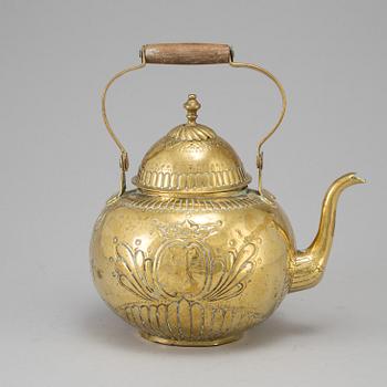 A 18th century brass tea pot.