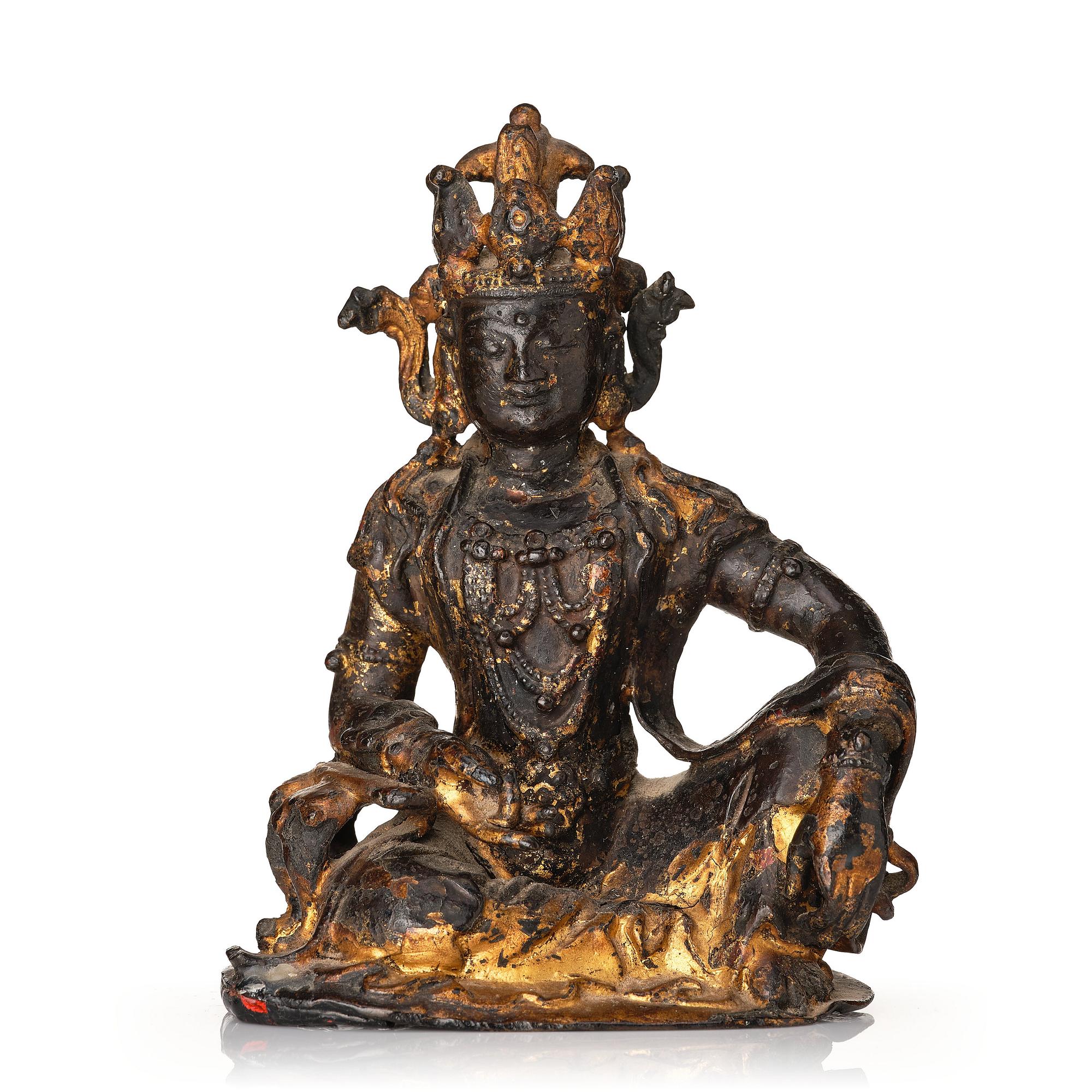 A cold gilt bronze figure of Avalokitshvara, Ming dynasty.