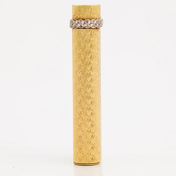 A cigarette lighter by Cartier set with single cut diamonds.