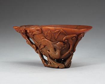 A finely carved rhinoceros libation cup, Qing dynasty, Kangxi (1662-1722).