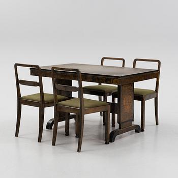 A Swedish Grace birch dining table and four chairs, 1920's/1930's.