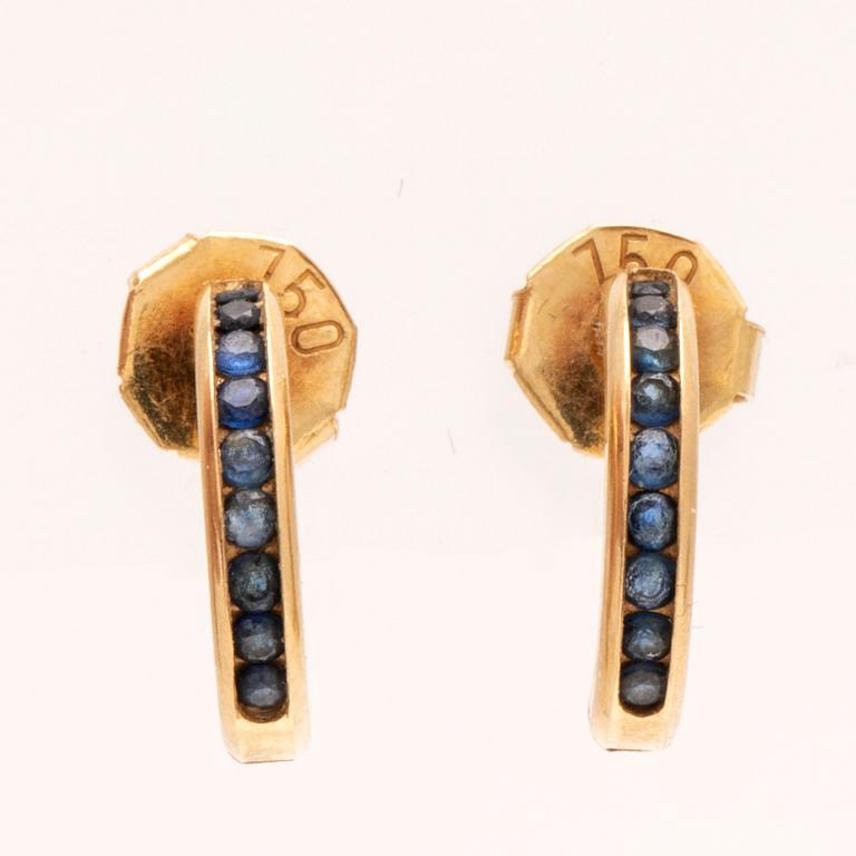 An 18K gold ring and a pair of earrings by H. Stern set with round brilliant cut diamonds and sapphires.