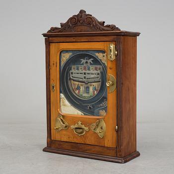 A 'Coleurs Nationales' Bussouz slot machine, Paris, France, circa 1900.