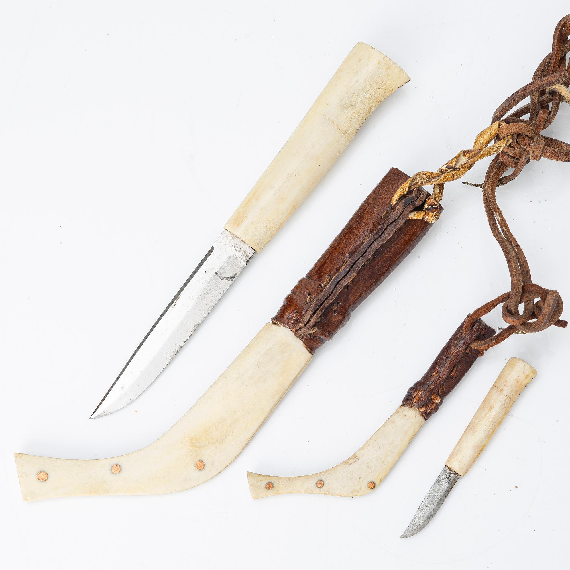 Half-horn knives, cup, bottle, needle case.