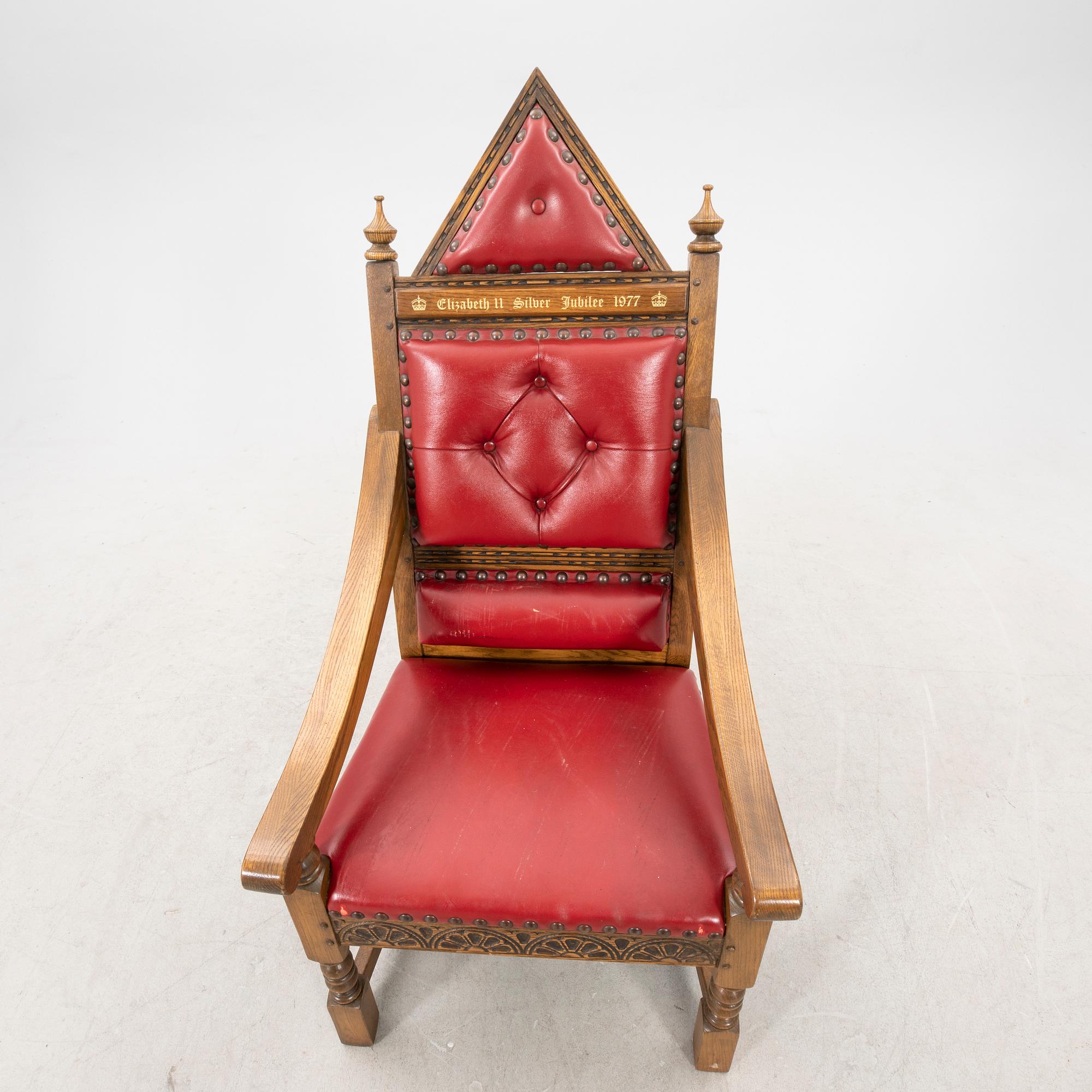 A oak and leather throne commemorating Elizabeth II silver jubilee 1977 by Wood Bros. Ltd.
