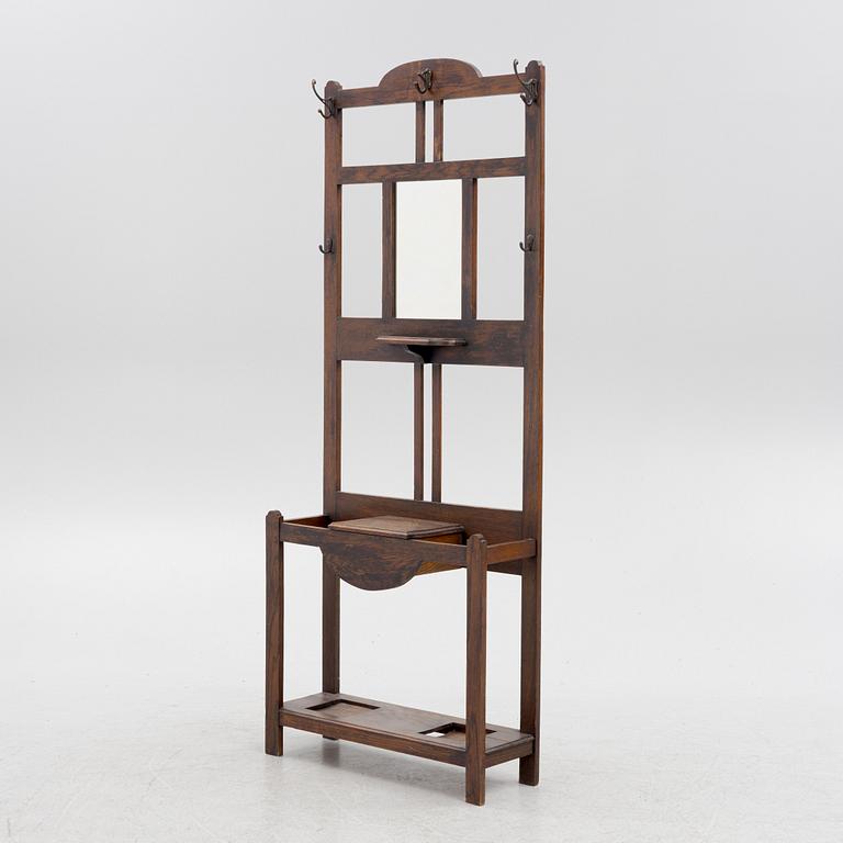 An oak coat hanger and umbrella stand, Early 20th century.