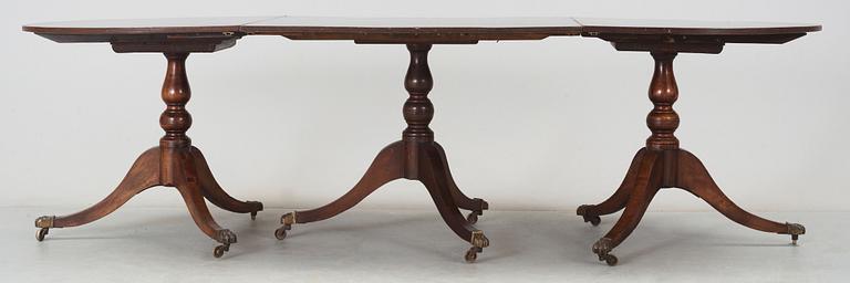 An English Regency and later mahogany dining table.