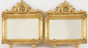 A pair of rococo-revival giltwood two-light girandoles, circa 1900.