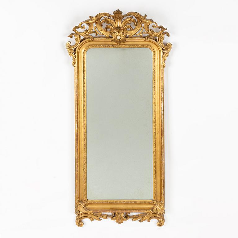 A Rococo revival mirror and a console table, second half of the 20th Century.