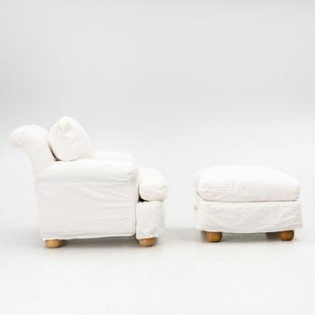 An armchair with ottoman, contemporary.
