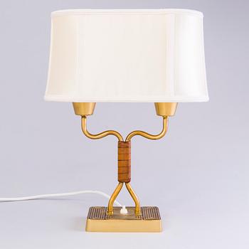 SONJA KATZIN, A 1940s brass table light from Asea, Sweden.