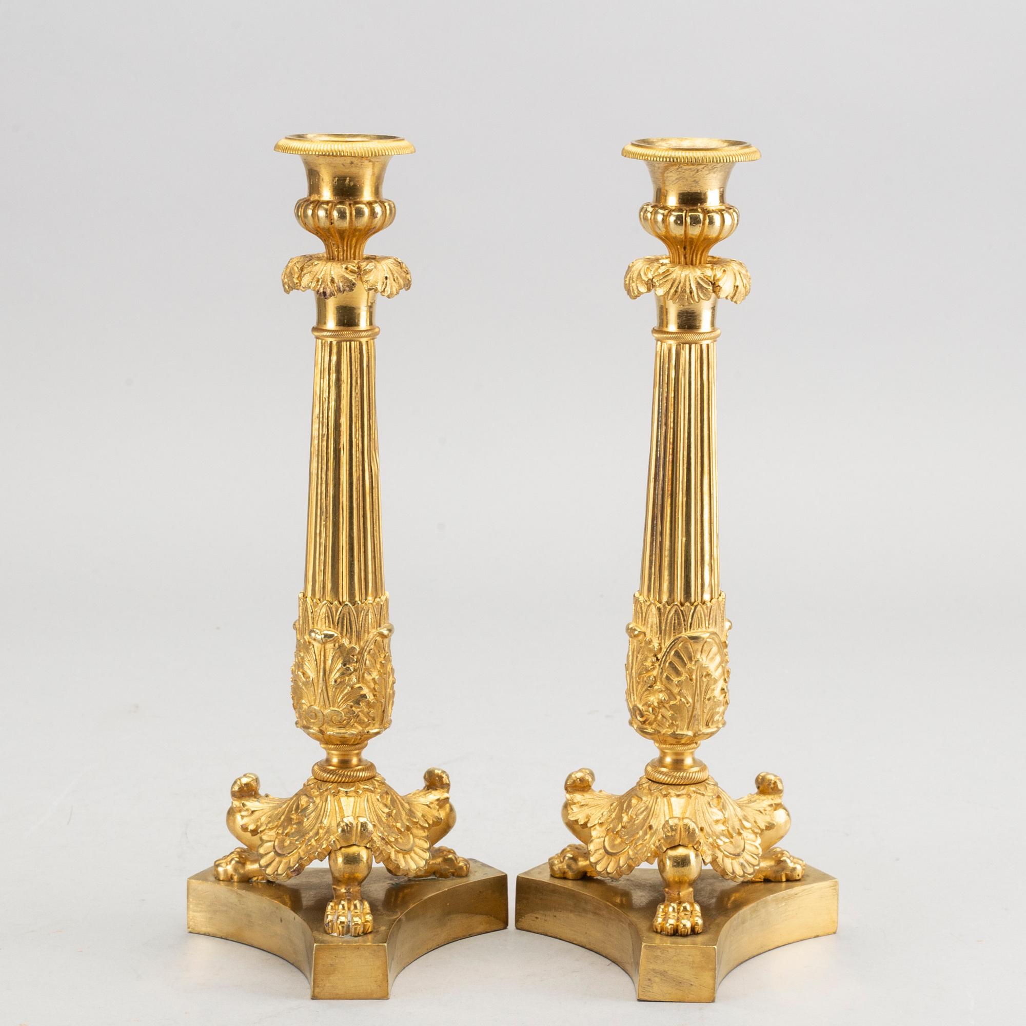 A pare of late empire candelsticks mid 19th century.