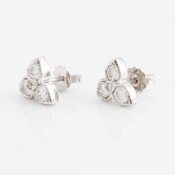 A pair of 18K white gold earrings with round brilliant-cut diamonds.