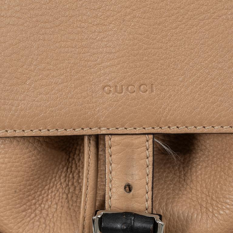 Gucci, a backpack.