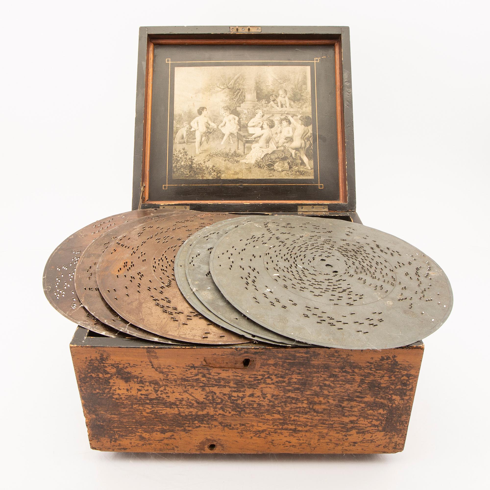 Polyphon wooden music box with sevem discs, around 1900's.