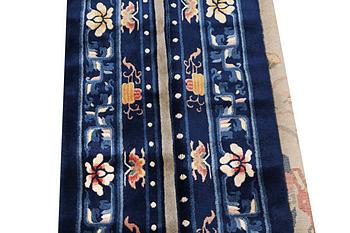 A rug, China, antique finish, ca 206 x 117 cm.