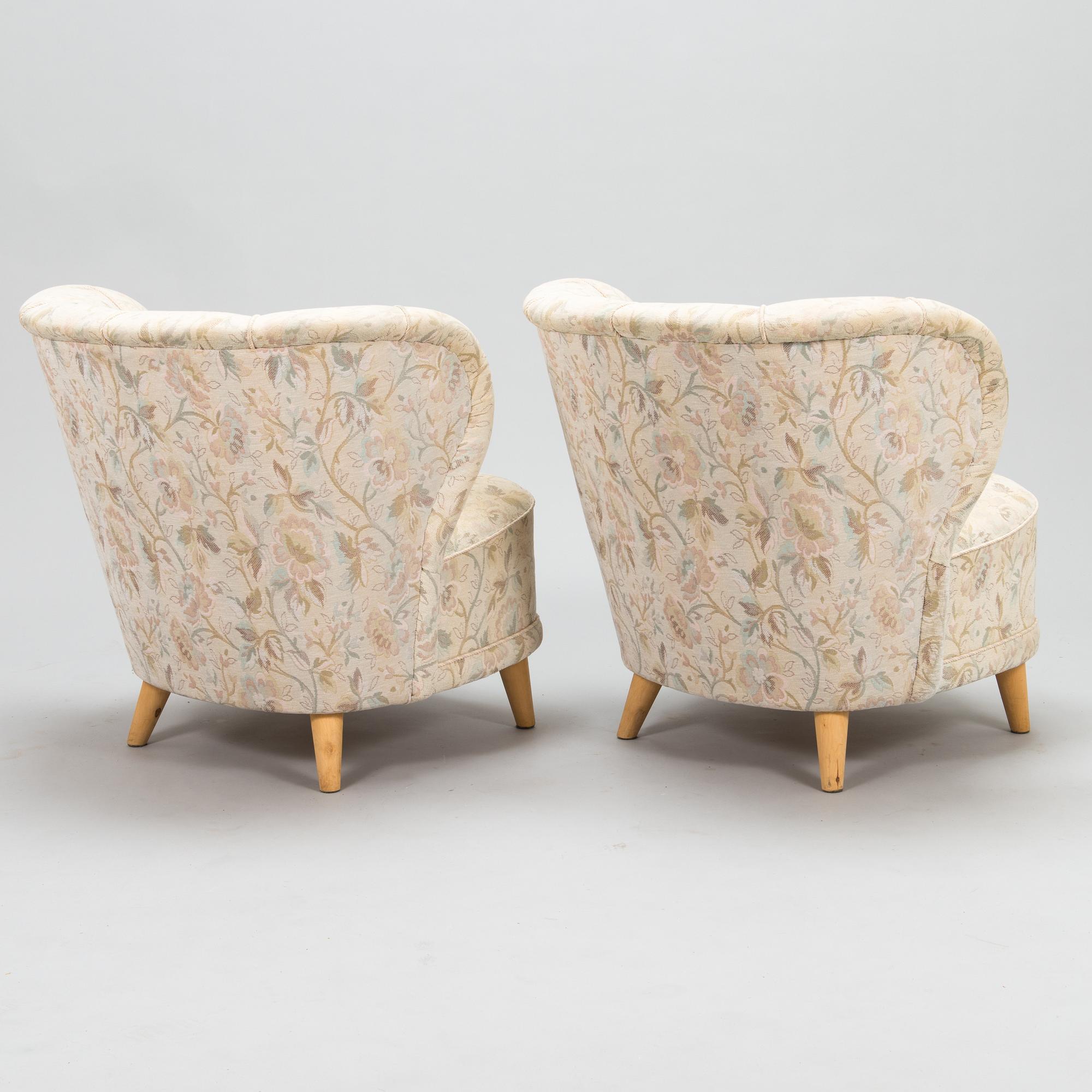 A pair of mid 20th century armchairs.