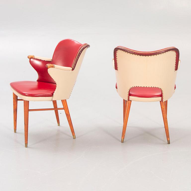 A pair of 1950s armchairs.