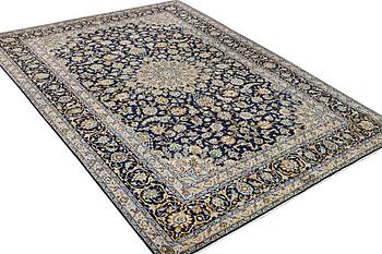 A Kashan carpet, c. 343 x 236 cm.