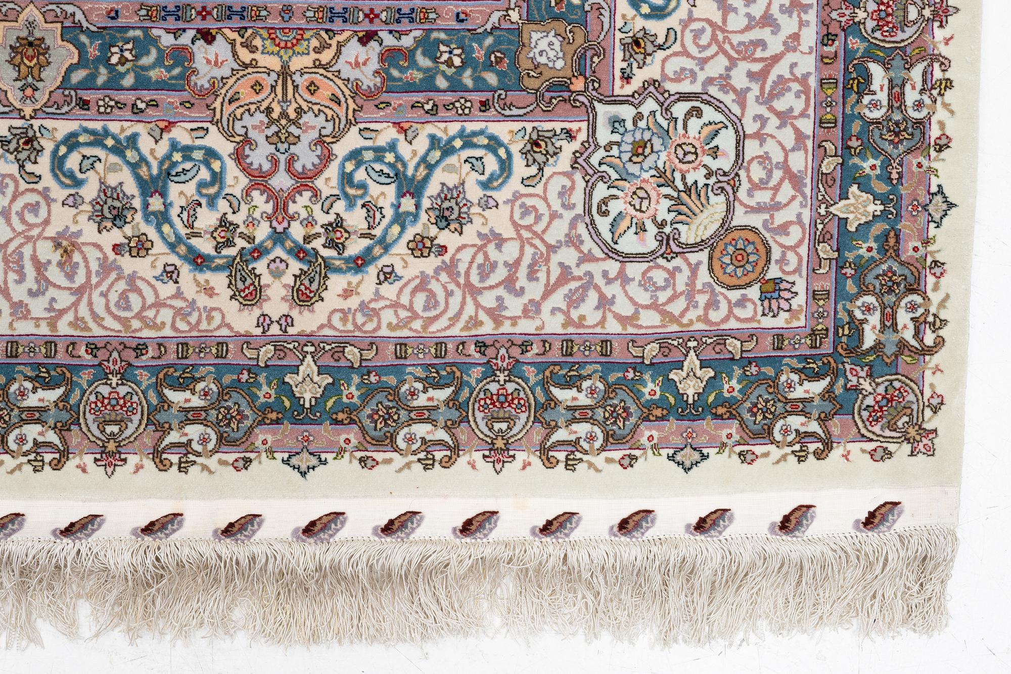 A Tabriz, carpet, 310 x 195 cm. signed.