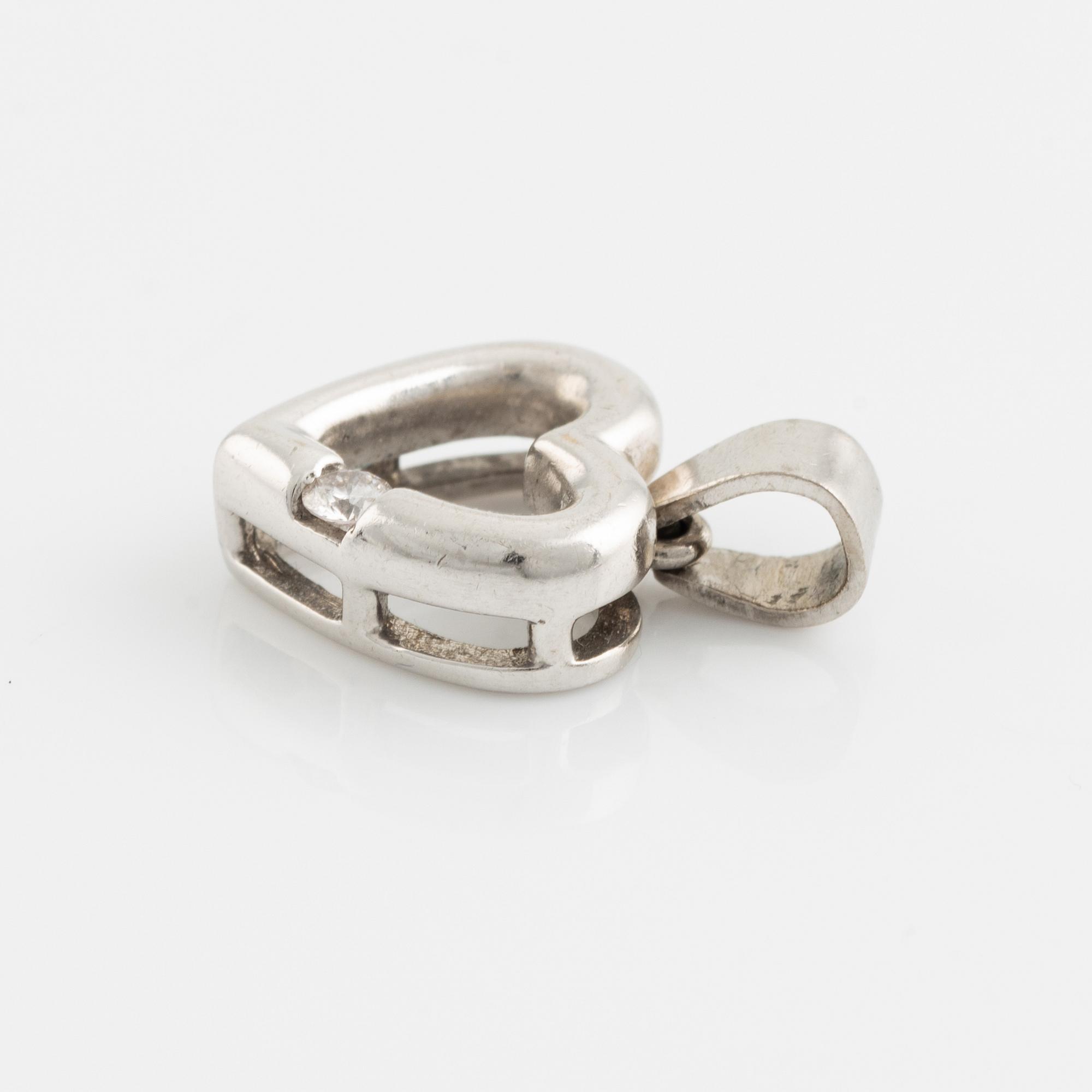 White gold and brilliant cut diamond heart pendant.