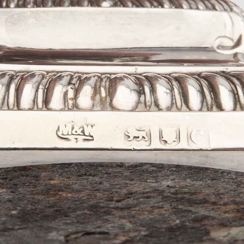 An English 20th century pair of silver candle sticks mark of Mappin & Webb London around 1900.