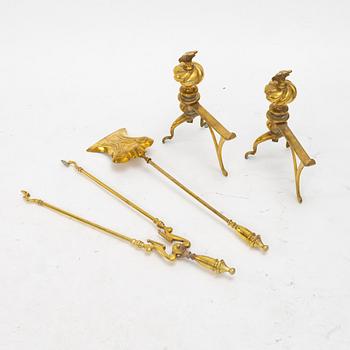 A four piece brass fire set, early 20th Century.