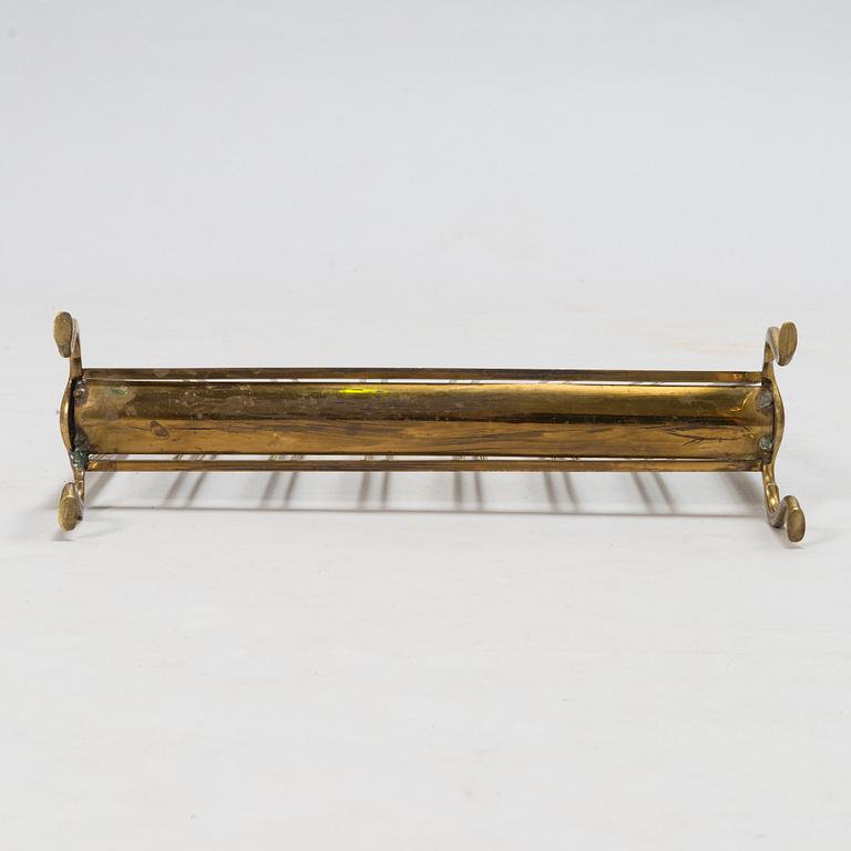 A folding brass magazine stand, first half of the 20th century.