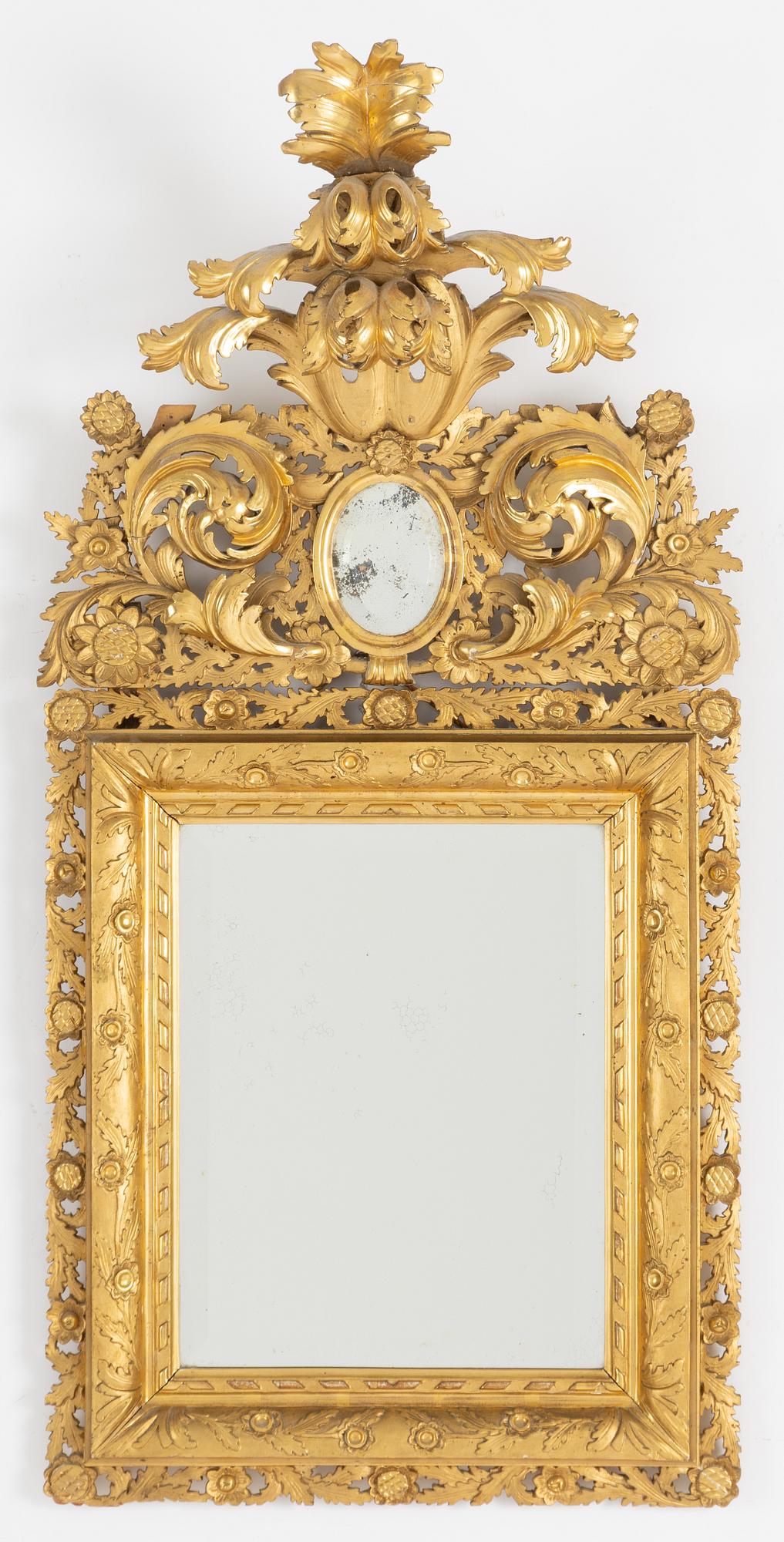 A 20th century Baroque style mirror.
