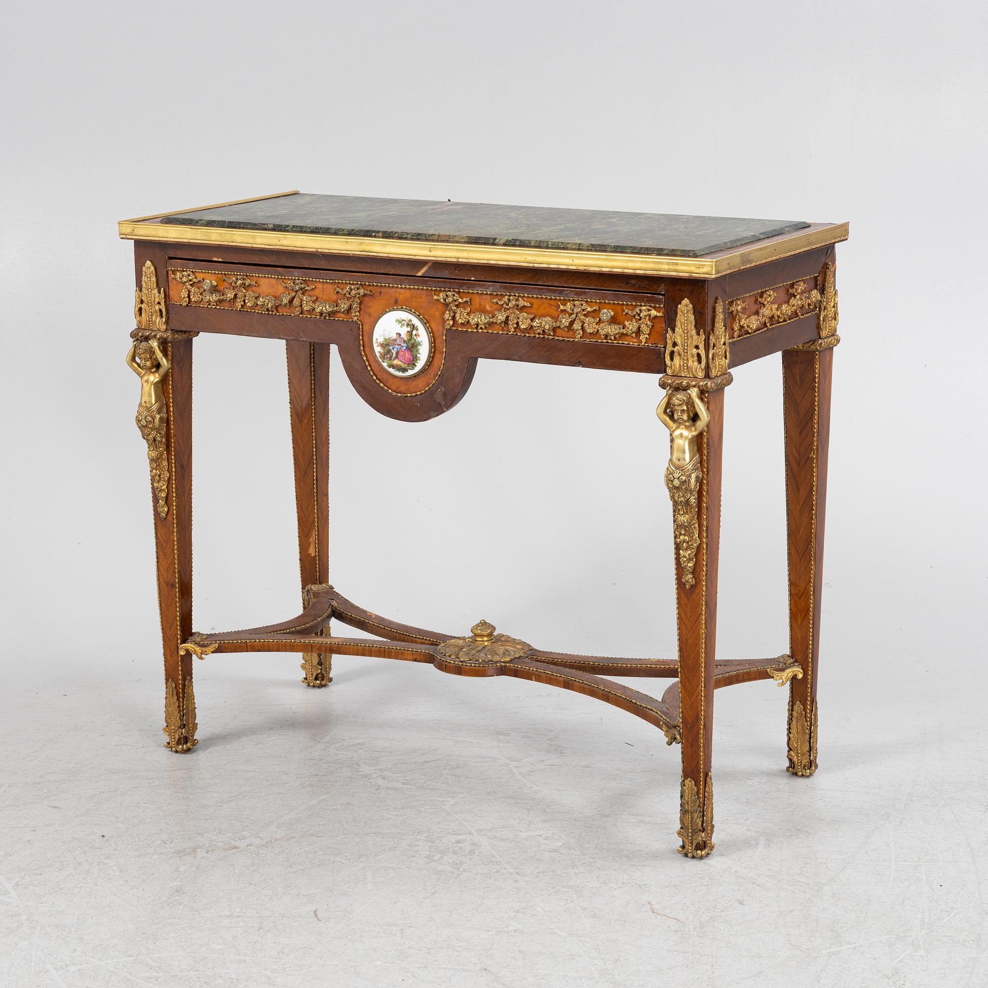 A Louis XVI-style gilt-brass mounted console table, circa 1900.