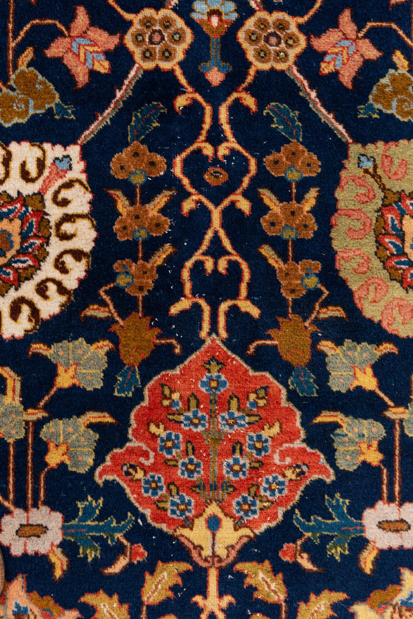 A semi-antique Tabriz carpet, c. 395 x 295 cm.