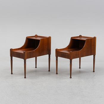 A pair of mahogany veneered bedside tables, later part of the 20th Century.