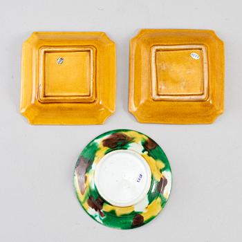 Two yellow glazed dish and an egg and spinach glazed dish, Qing dynasty, 18th/19th Century.