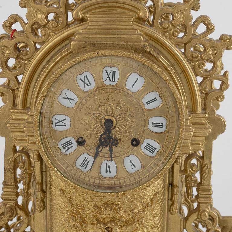 Table garniture, mantel clock, and two candelabras, Louis XV style, Lancini, Italy, second half of the 20th century.